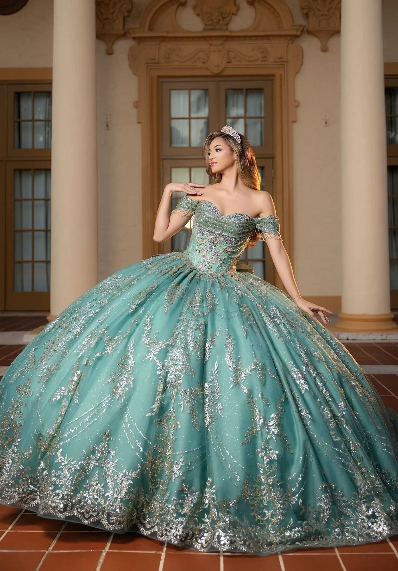Morilee sage green quinceañera ball gown with silver sequin lace and an off-the-shoulder sweetheart bodice