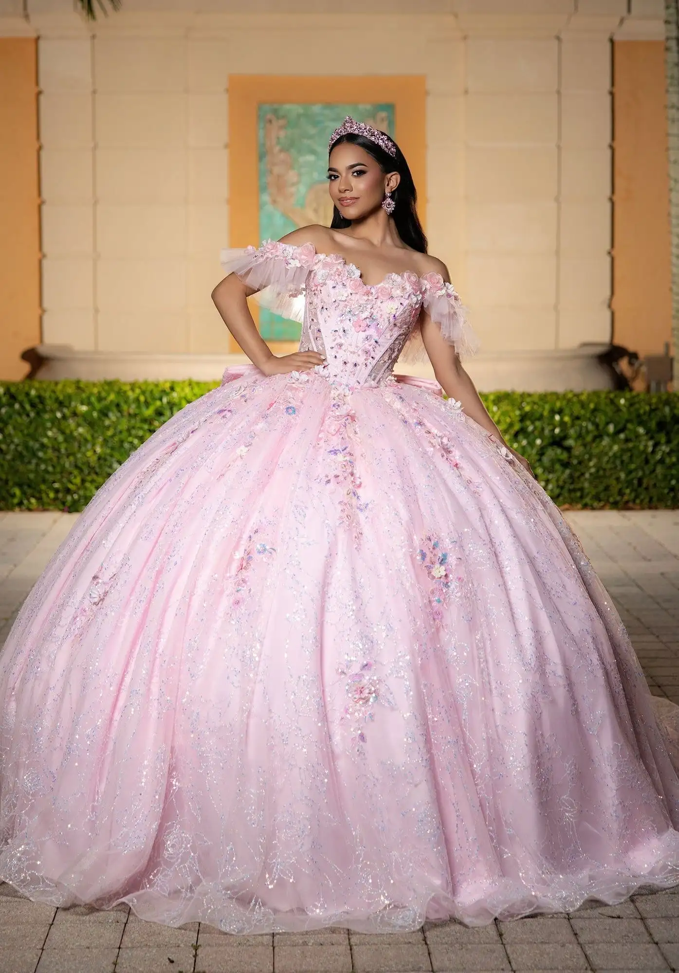 Morilee pale pink quinceañera ball gown with 3D floral appliqués and a beaded corset bodice