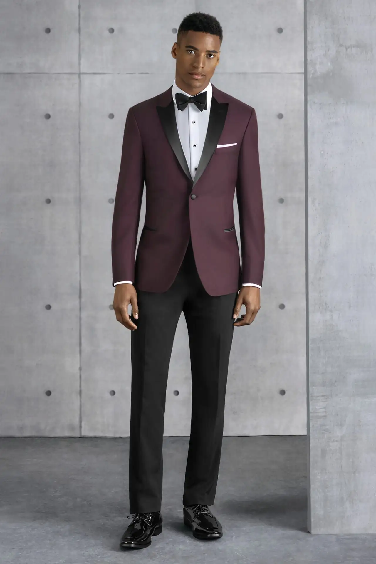 Jim's Formal Wear burgundy tuxedo jacket with a black satin lapel and black trousers