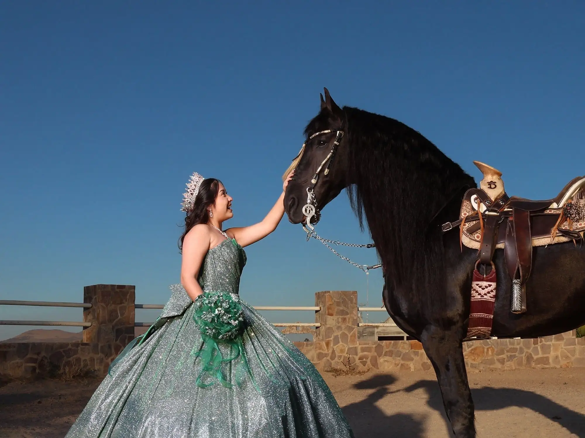 A quinceañera in a full ball gown